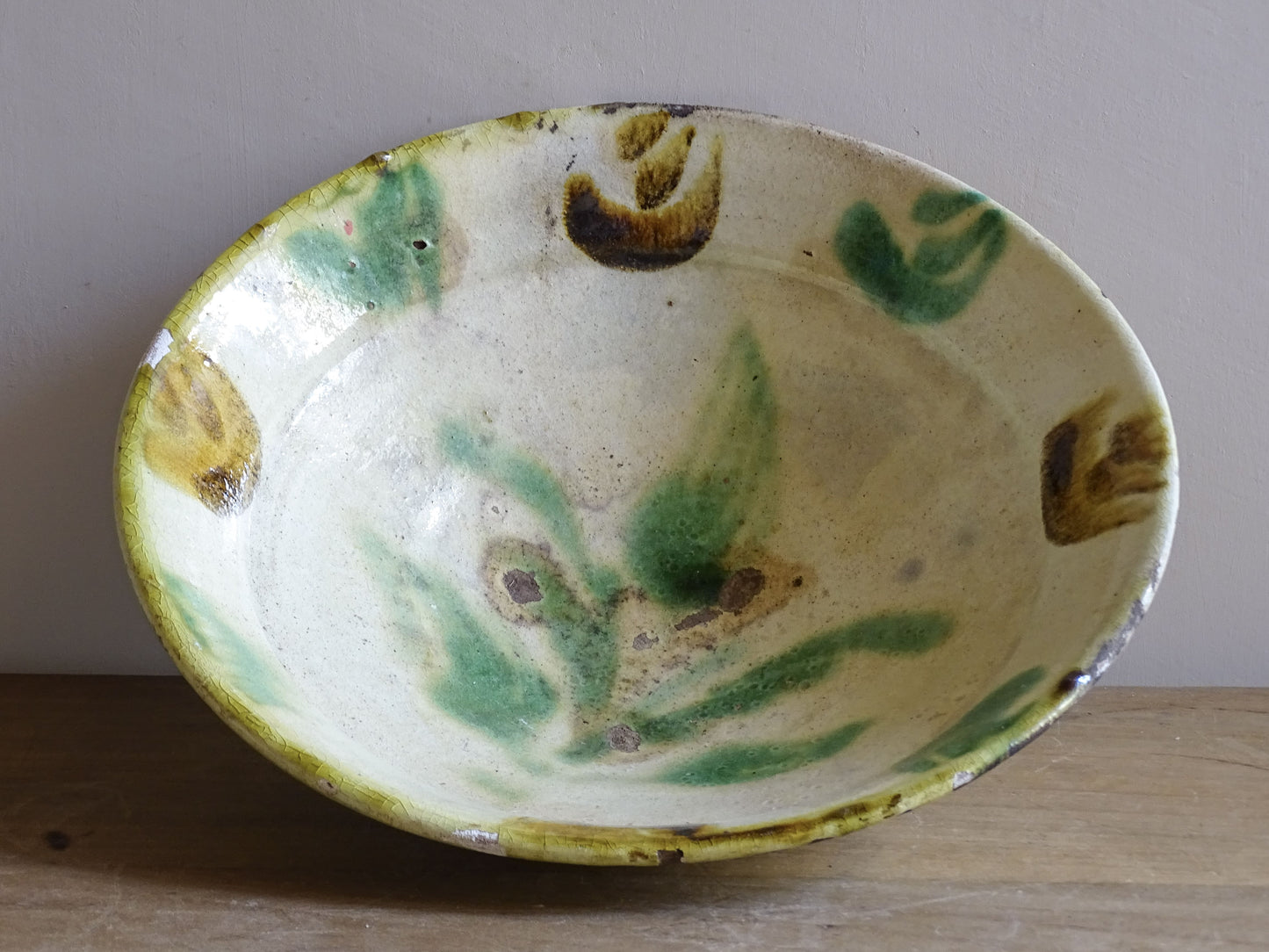 Rustic French ceramic bowl with natural wear and hand painted glaze details