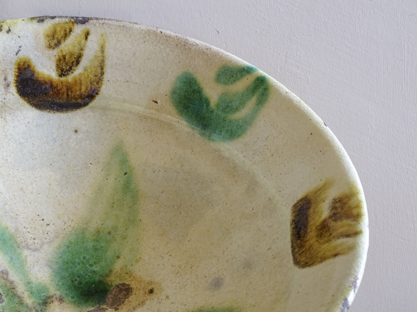 Base of French antique pottery bowl showing foot ring and aged glaze