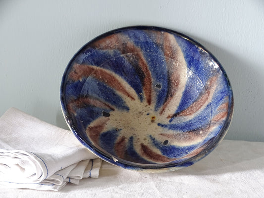 French vintage ceramic bowl with a blue, manganese, and beige swirled glaze