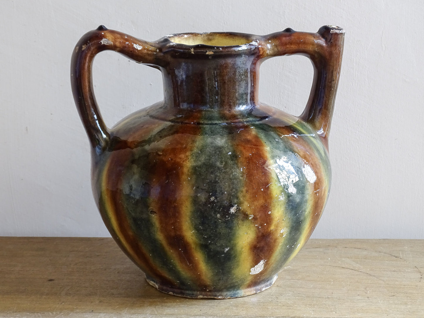 South of France pottery vessel with twin handles and earthy striped glaze