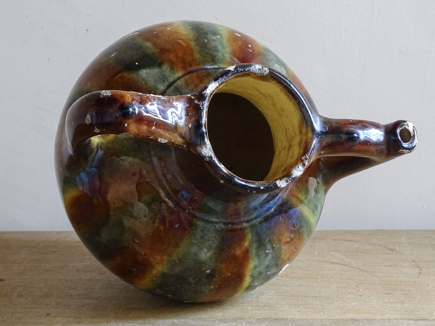 French pottery orjol  jug with twin handles and flowing glaze finish