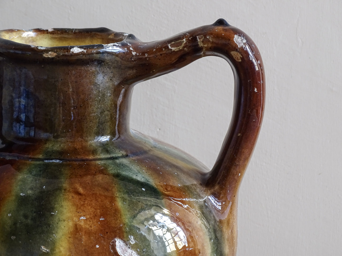 Antique French ceramic vessel with striped glaze and rounded form