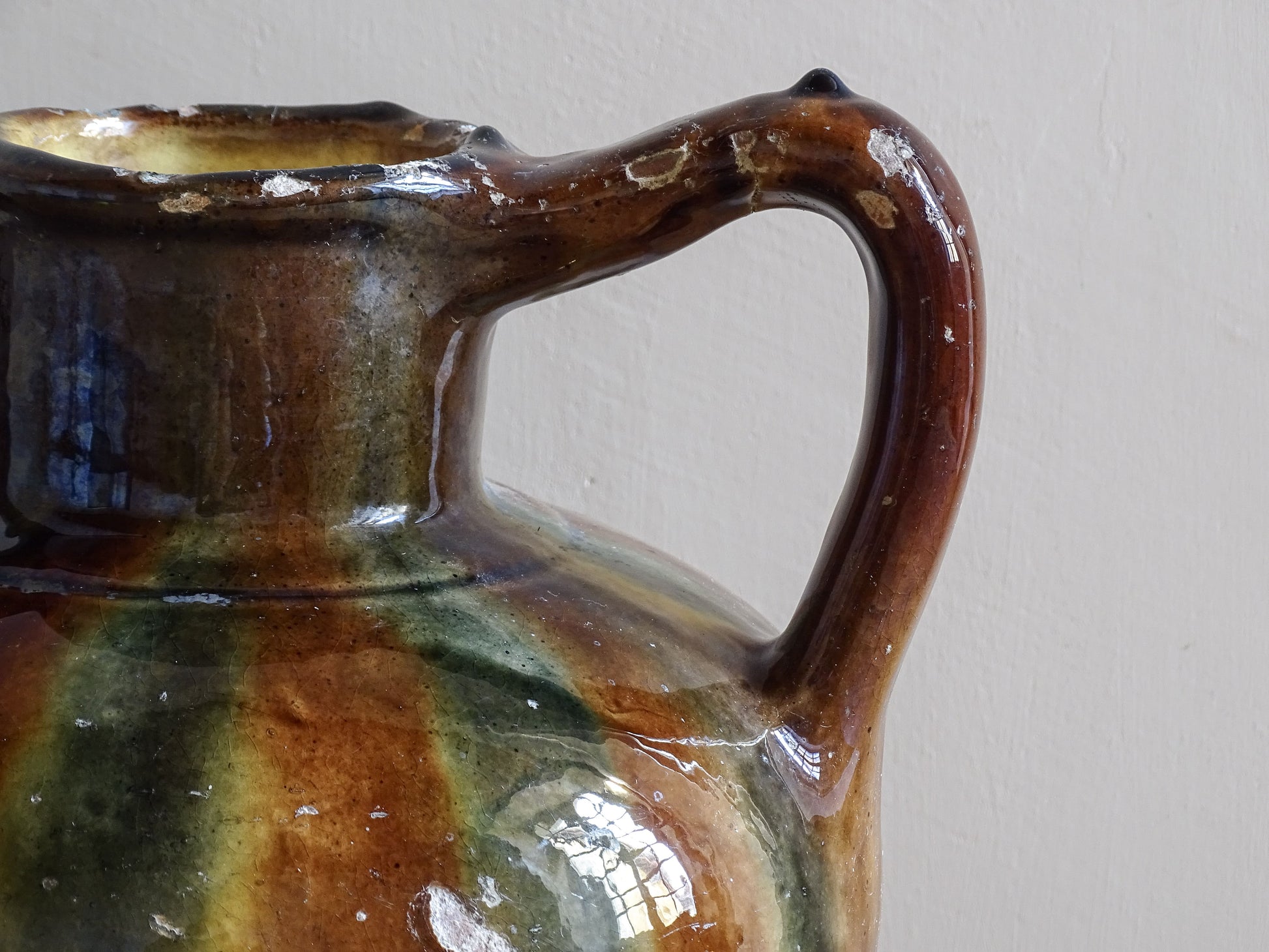 Antique French ceramic vessel with striped glaze and rounded form