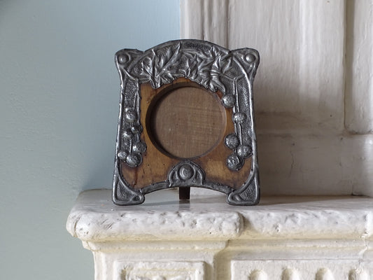 French antique art nouveau photo frame in wood and pewter, pictured on a country house fireplace