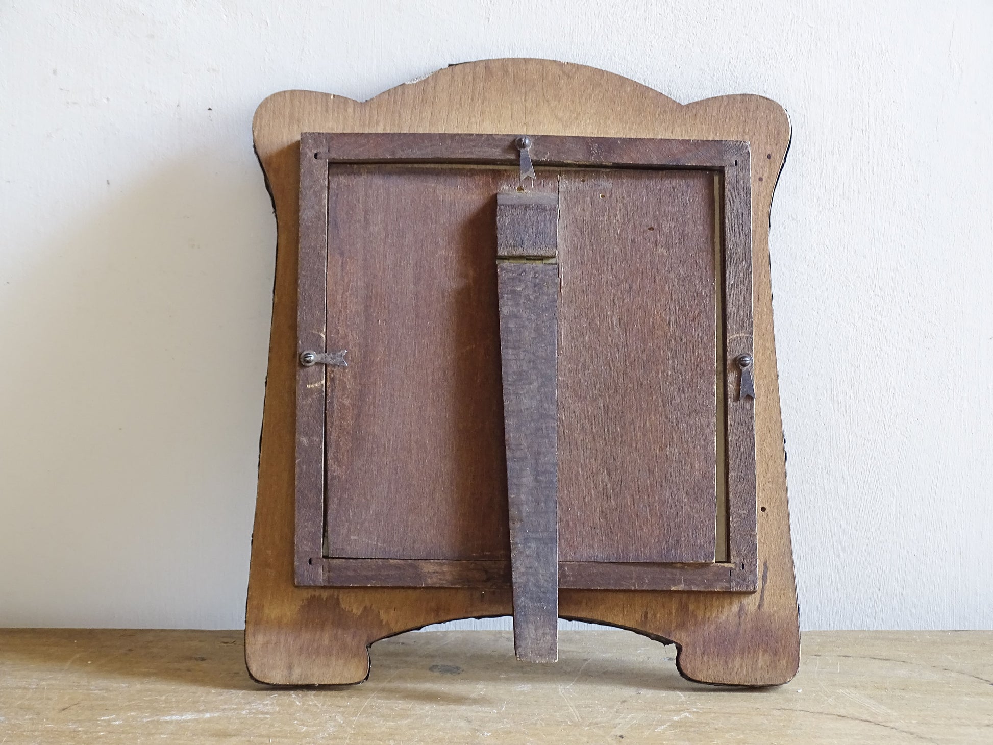 Antique pewter-clad Art Nouveau frame displayed on wooden table