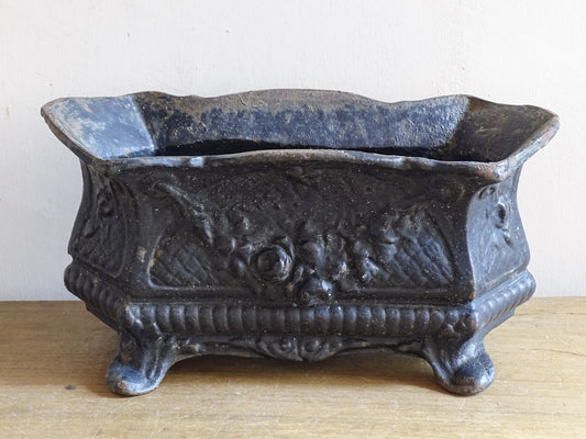 Small French cast iron planter with garland and floral rosette detail