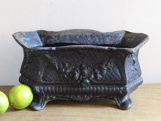 French antique cast iron jardinière with floral relief and aged patina