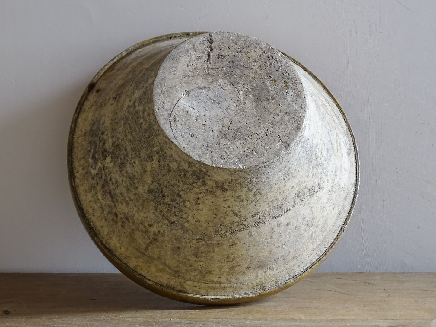 A beautiful French antique tian bowl with a warm mustard yellow glaze and wonderfully timeworn surface. 