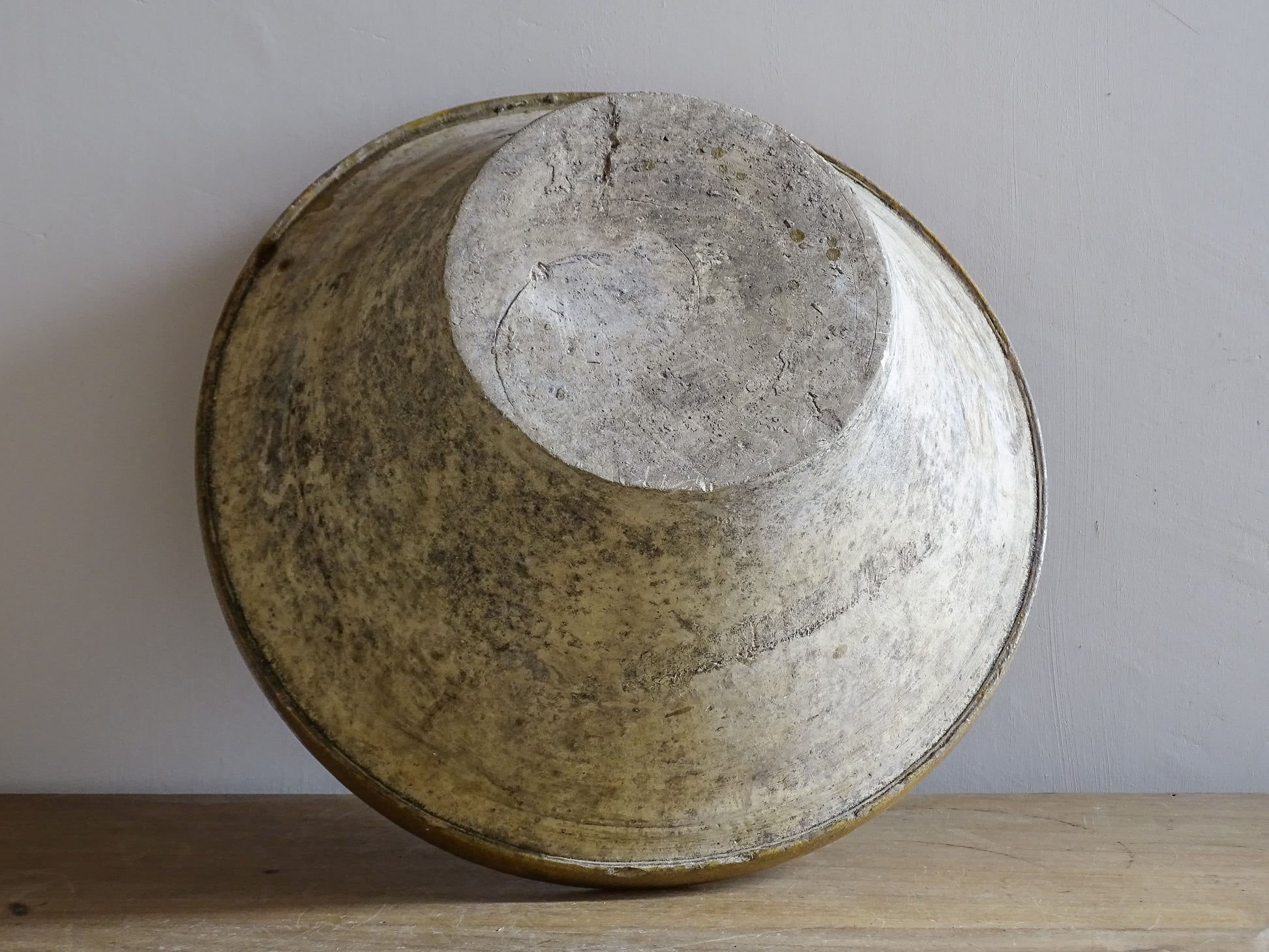 A beautiful French antique tian bowl with a warm mustard yellow glaze and wonderfully timeworn surface. 