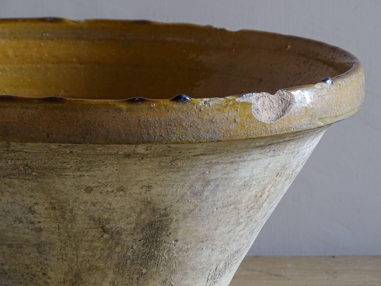 A beautiful French antique tian bowl with a warm mustard yellow glaze and wonderfully timeworn surface. 
