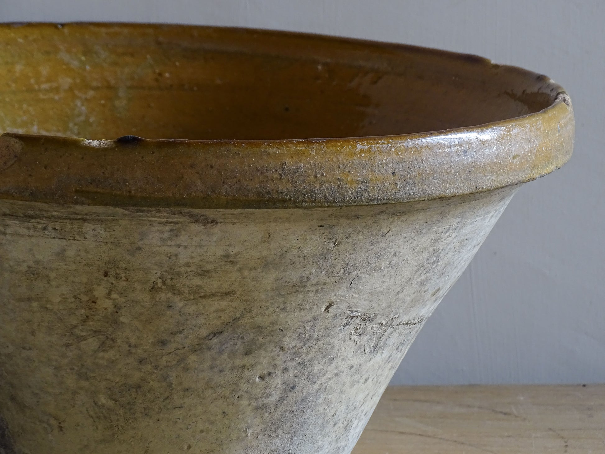 A beautiful French antique tian bowl with a warm mustard yellow glaze and wonderfully timeworn surface. 