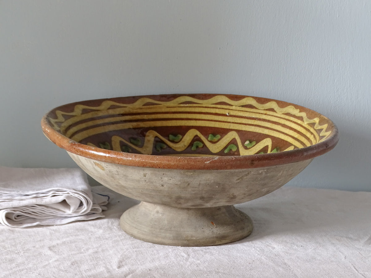French antique Savoyard pottery bowl with orange glaze and pedestal base