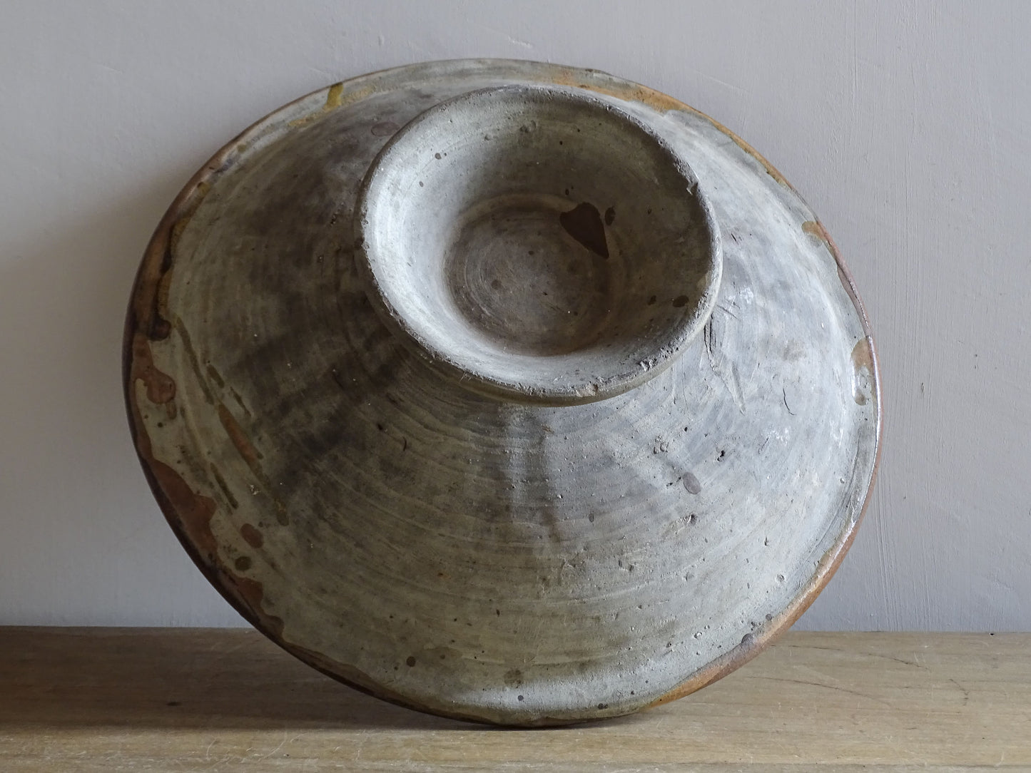 Large antique French glazed terracotta pedestal bowl with rustic slip-trailed design