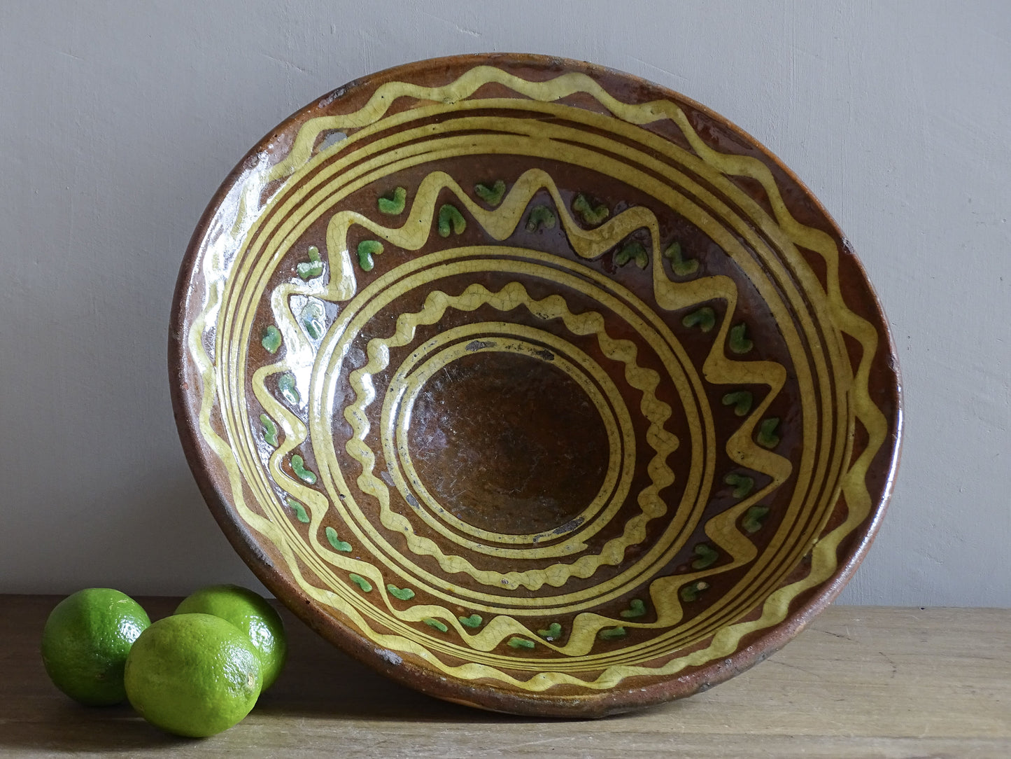 Antique French Alpine folk pottery bowl with pedestal foot and slip decoration