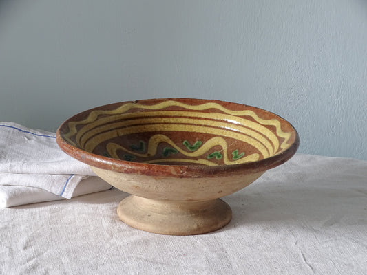 Rustic French antique pottery bowl with a pedestal base