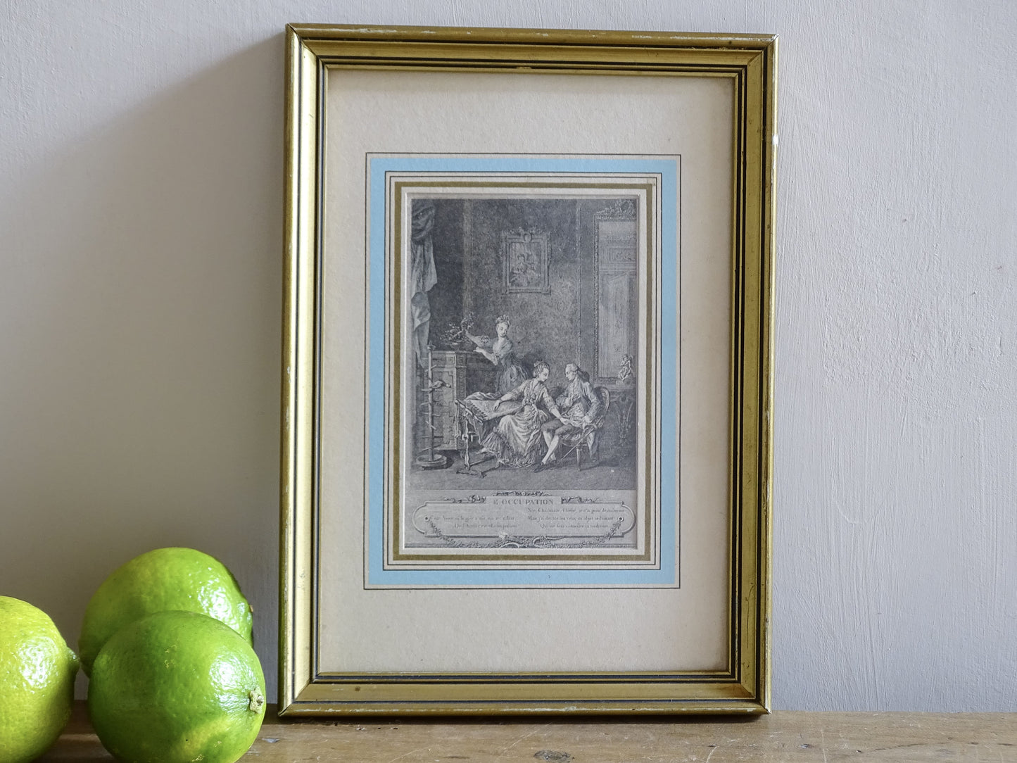 19th century French engraving titled L’Occupation in gilt frame with pale blue mount