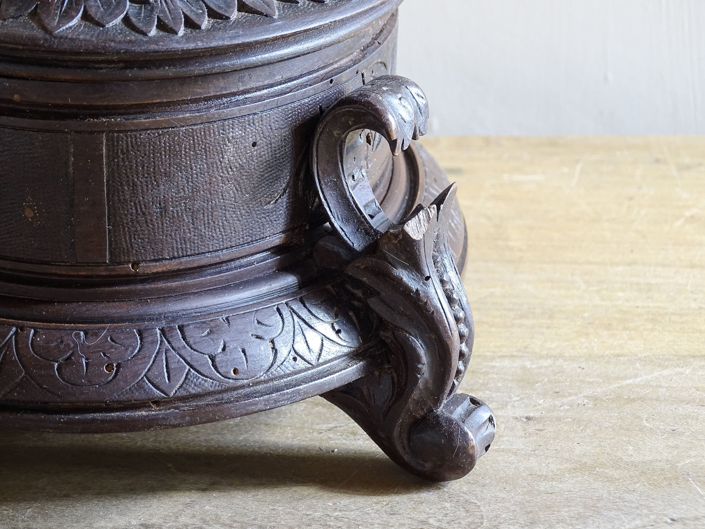 Antique Black Forest oval wooden box with blue tufted interior