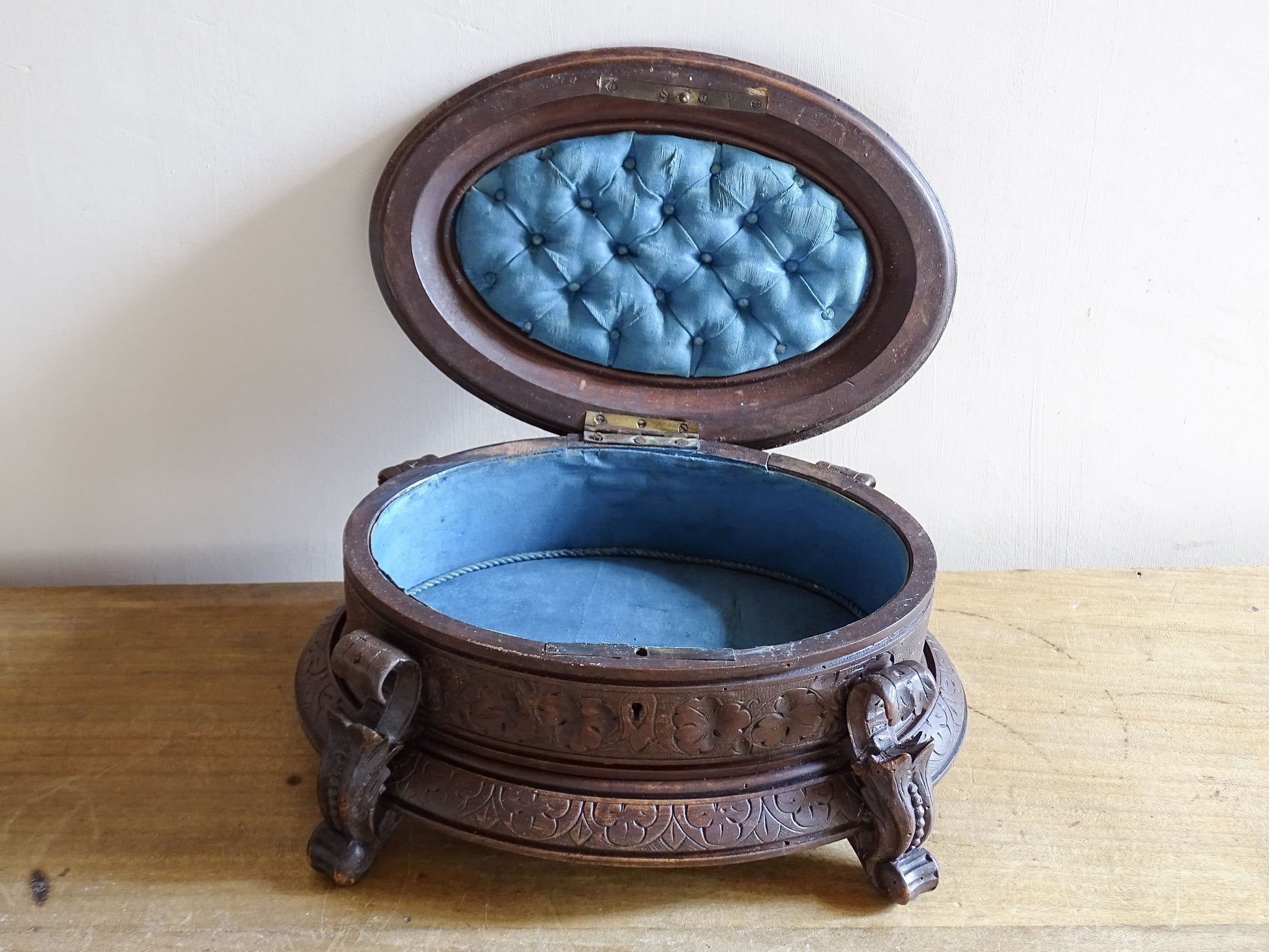 Antique carved wooden keepsake box with original blue lining