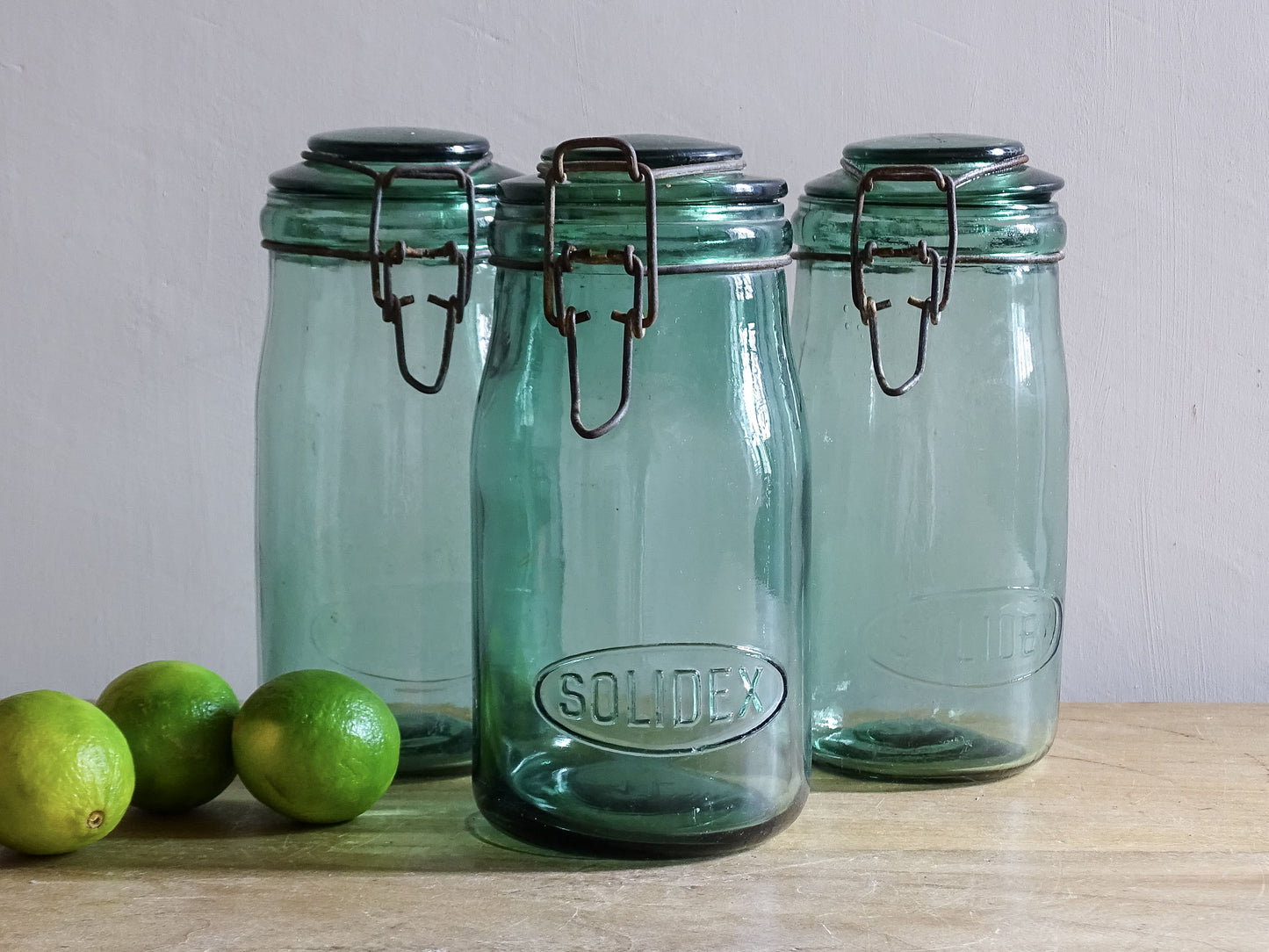 Set of three French vintage SOLIDEX aqua glass storage jars with wire closures