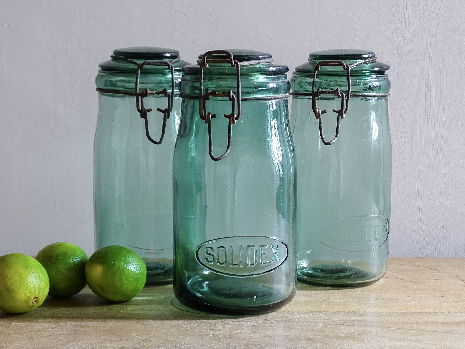 Set of three French vintage SOLIDEX aqua glass storage jars with wire closures
