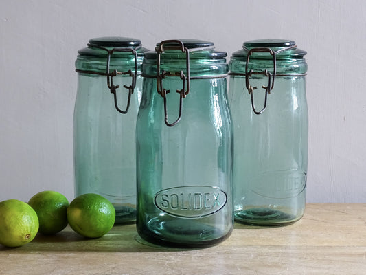 Set of three French vintage SOLIDEX aqua glass storage jars with wire closures