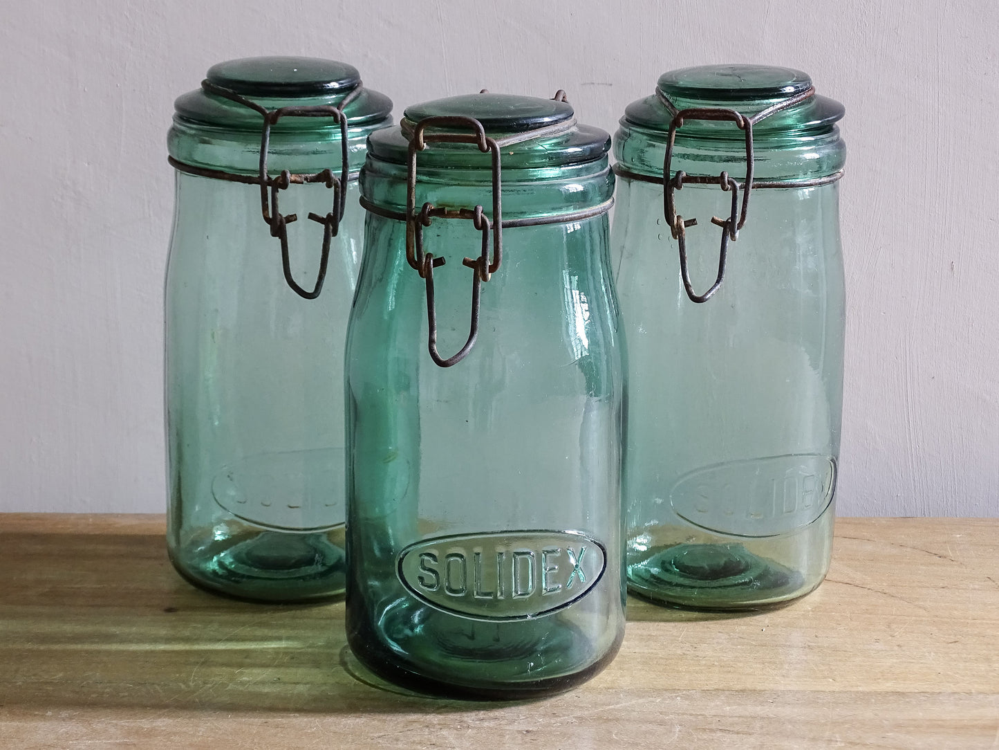 Rustic French pantry jars in aqua tinted glass with metal closures