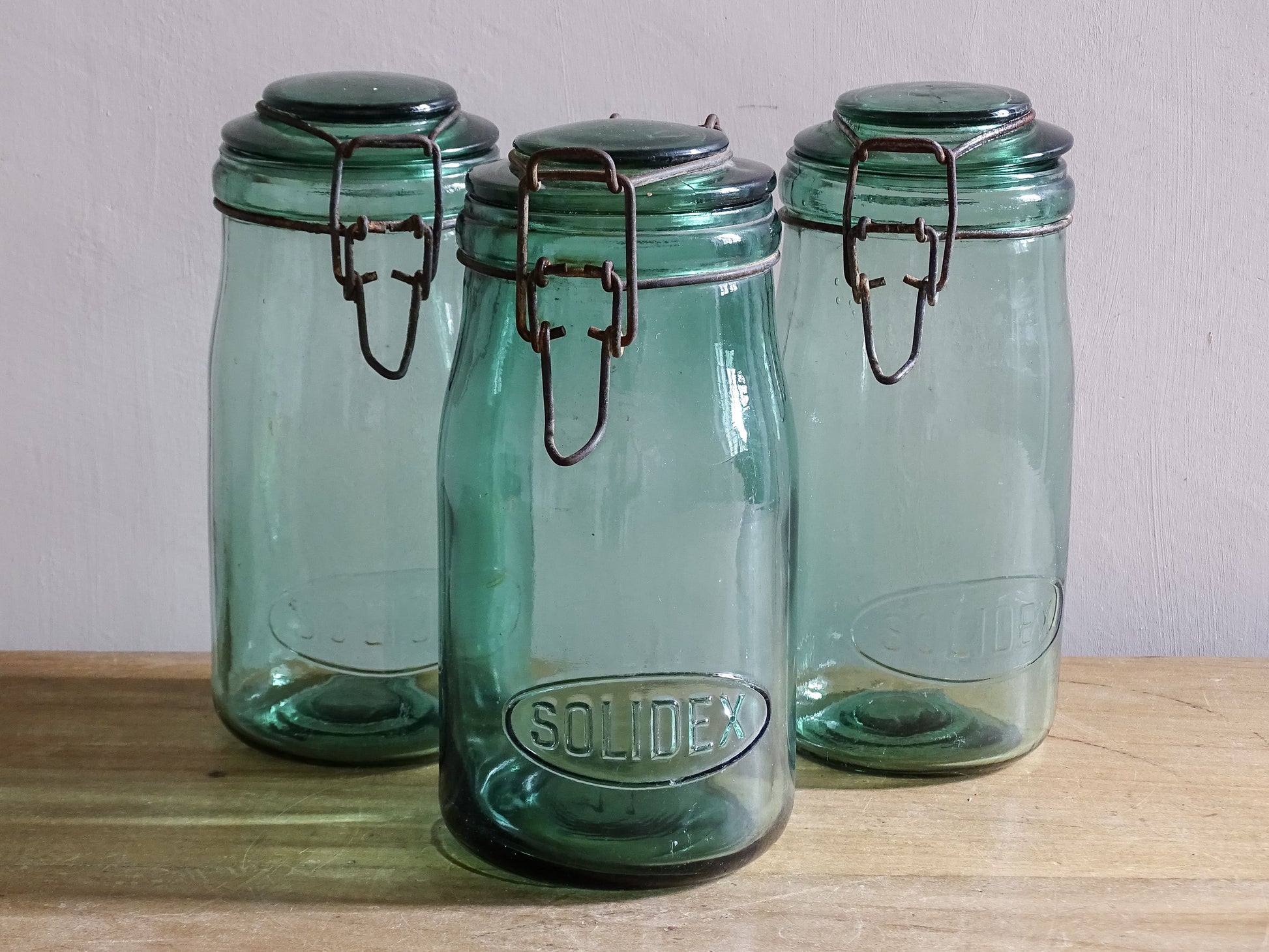Rustic French pantry jars in aqua tinted glass with metal closures
