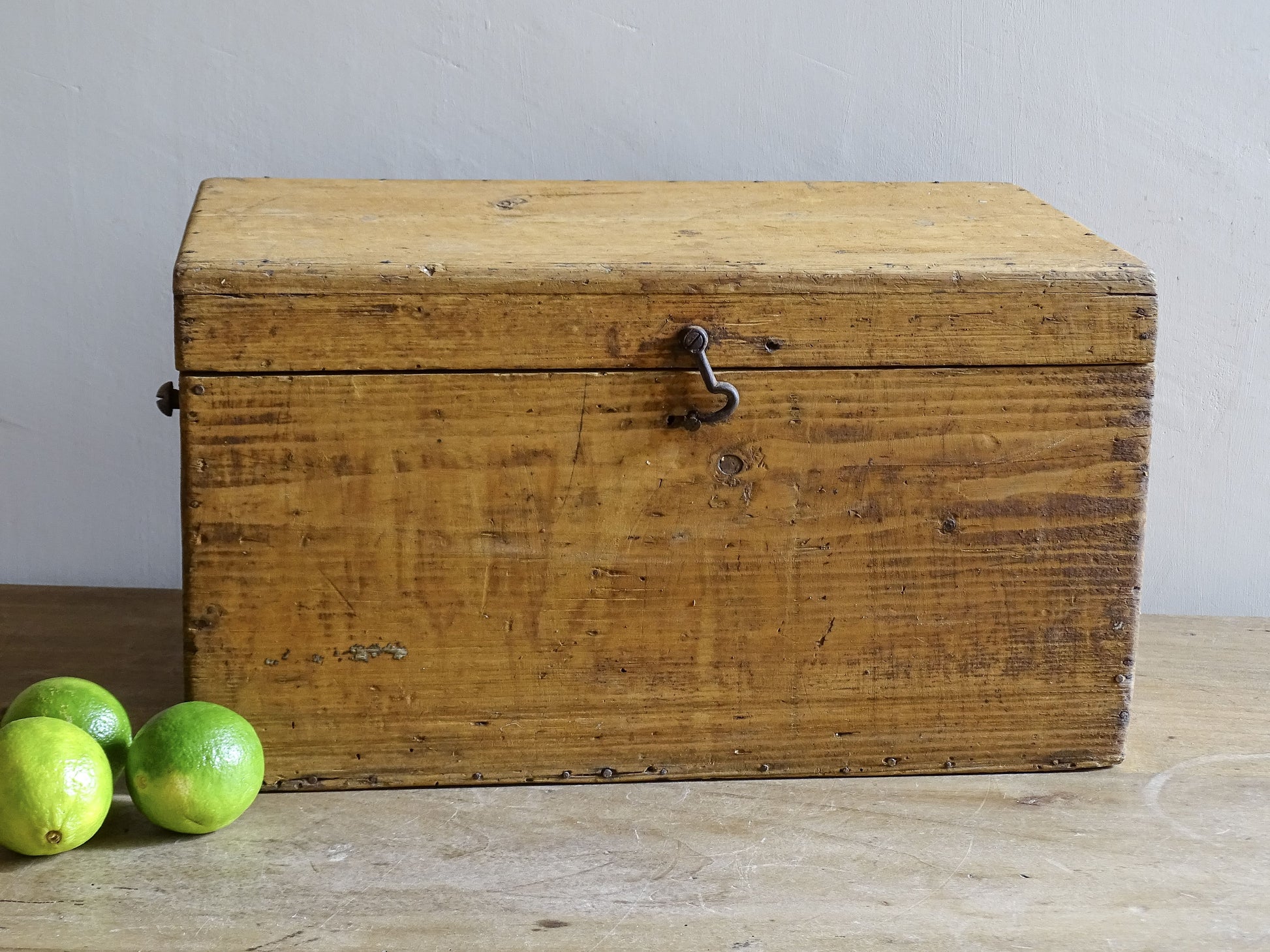 Rustic French wooden storage box with hinged lid and warm aged pine patina