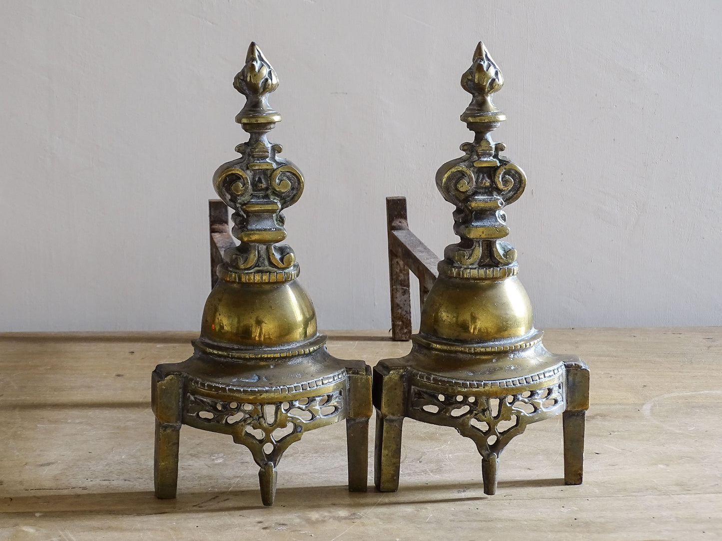 French antique firedogs with pierced Gothic style tracery