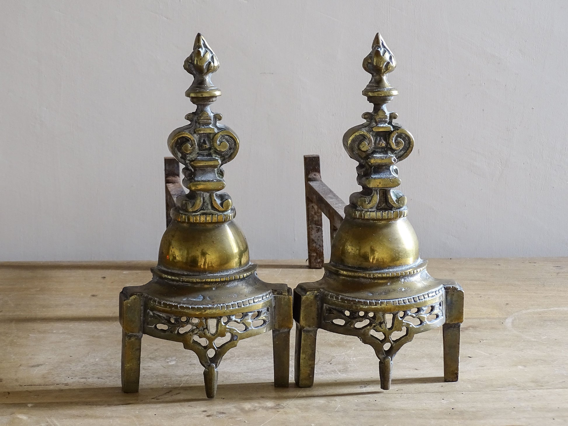 French antique firedogs with pierced Gothic style tracery
