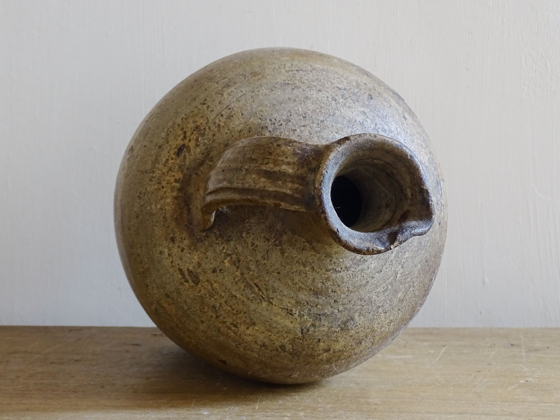 Small antique French pottery pitcher with sculptural rounded silhouette