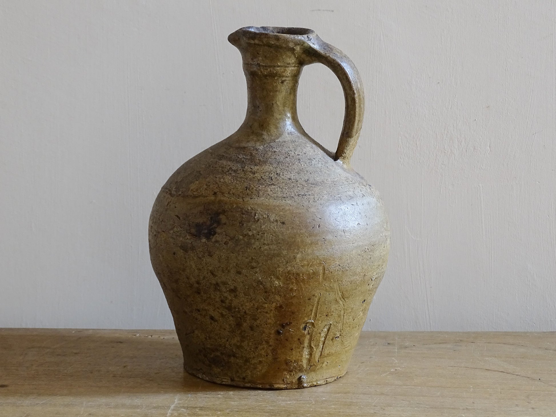 Antique French country pottery jug with aged honey and olive glaze