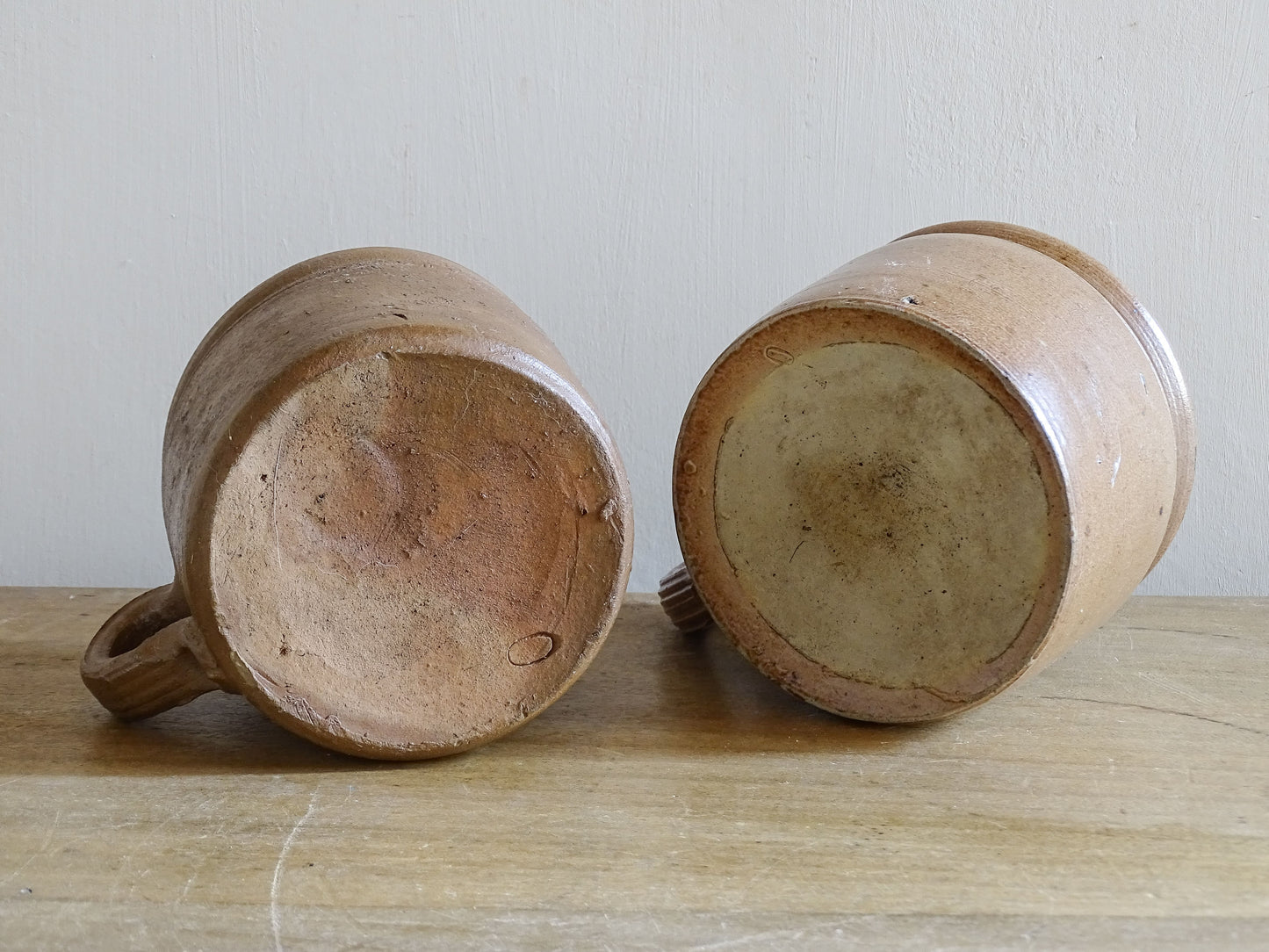 Rustic French farmhouse stoneware cups with hand-thrown character and rolled rims
