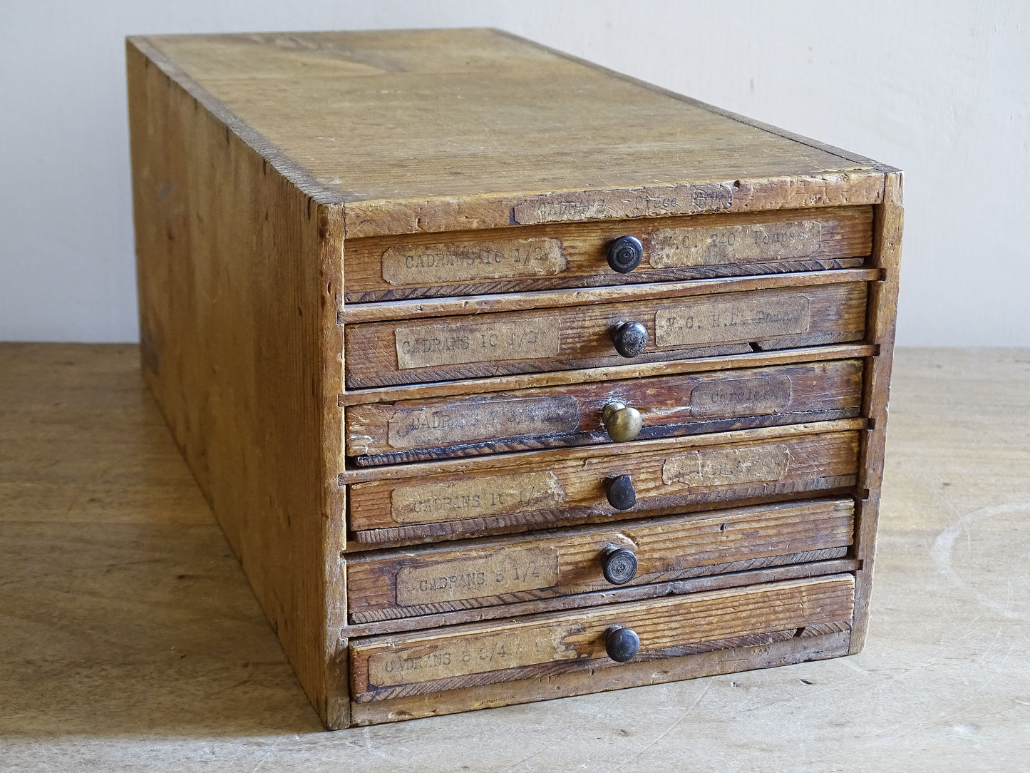 Rustic French wooden cabinet for watch and clock parts with six shallow drawers