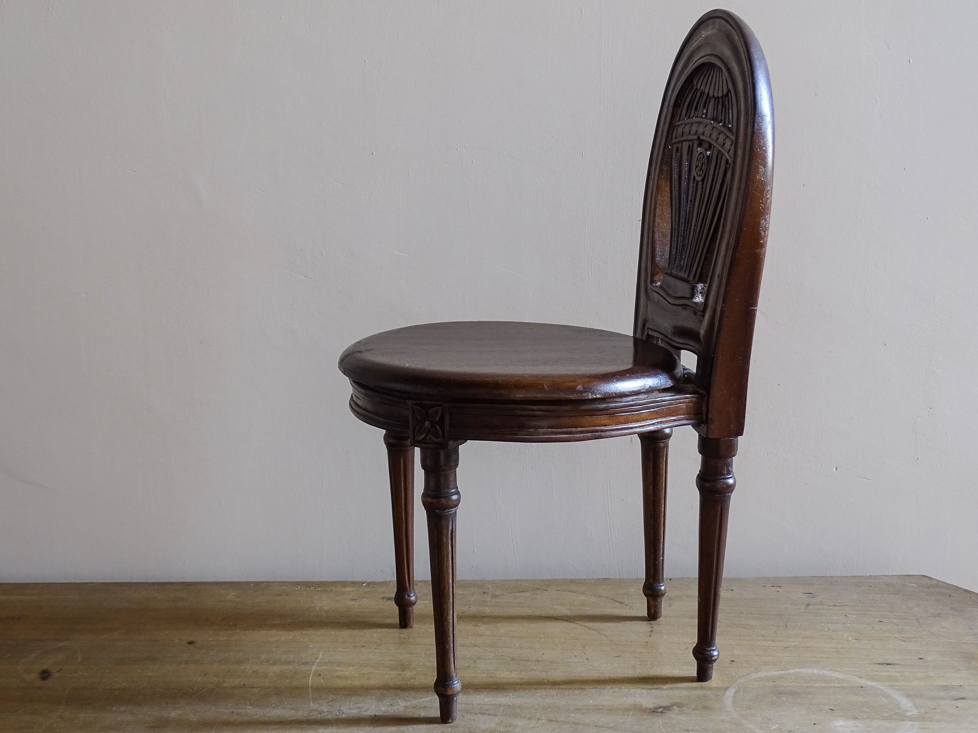 Antique miniature Louis XVI style chair with carved hot air balloon back splat