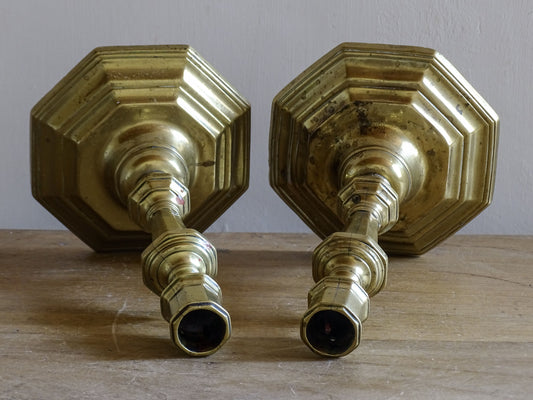 Late 19th century brass candlesticks with aged patina and turned stems