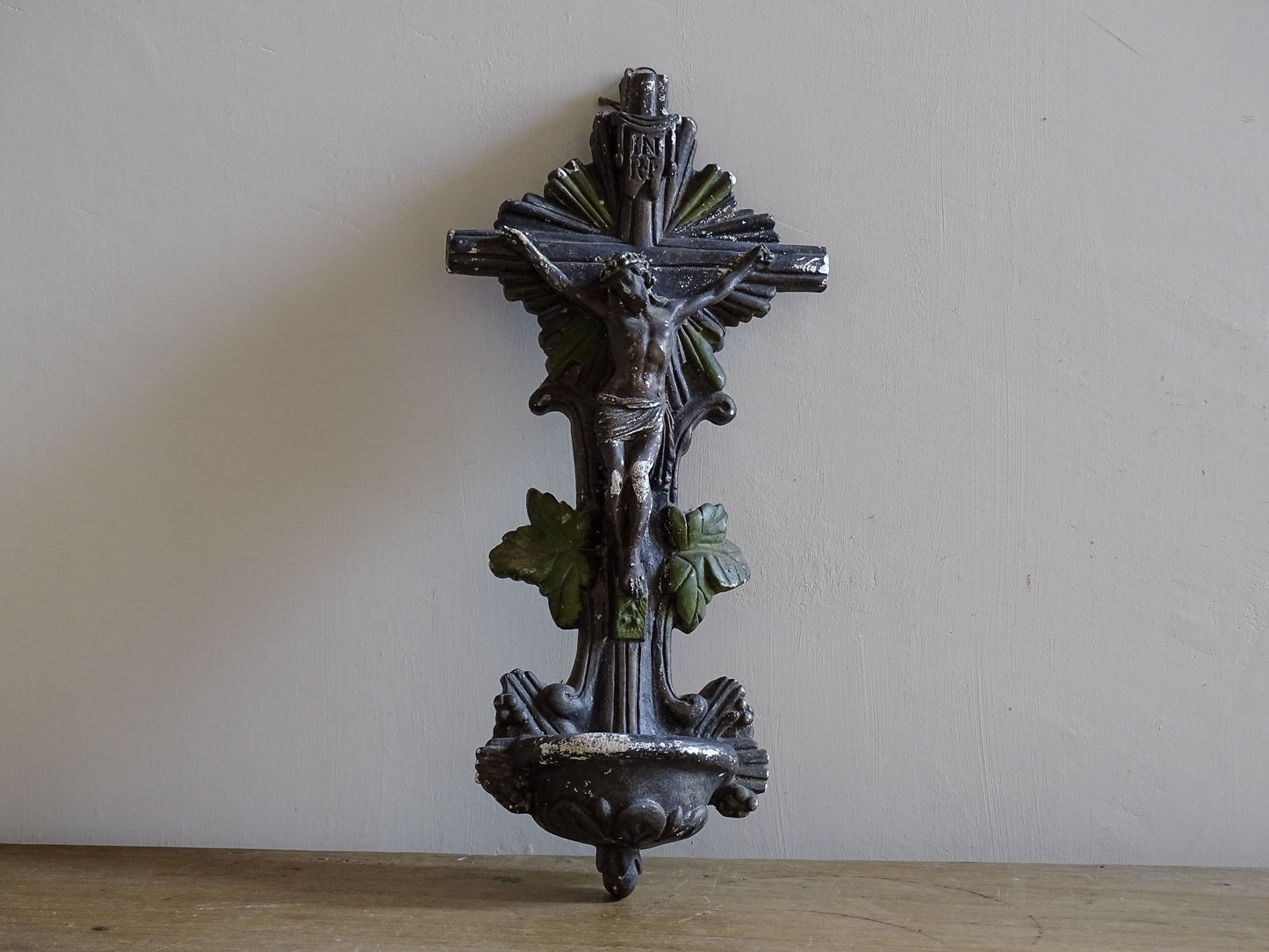 Antique French bénitier wall font with crucifix and aged painted finish