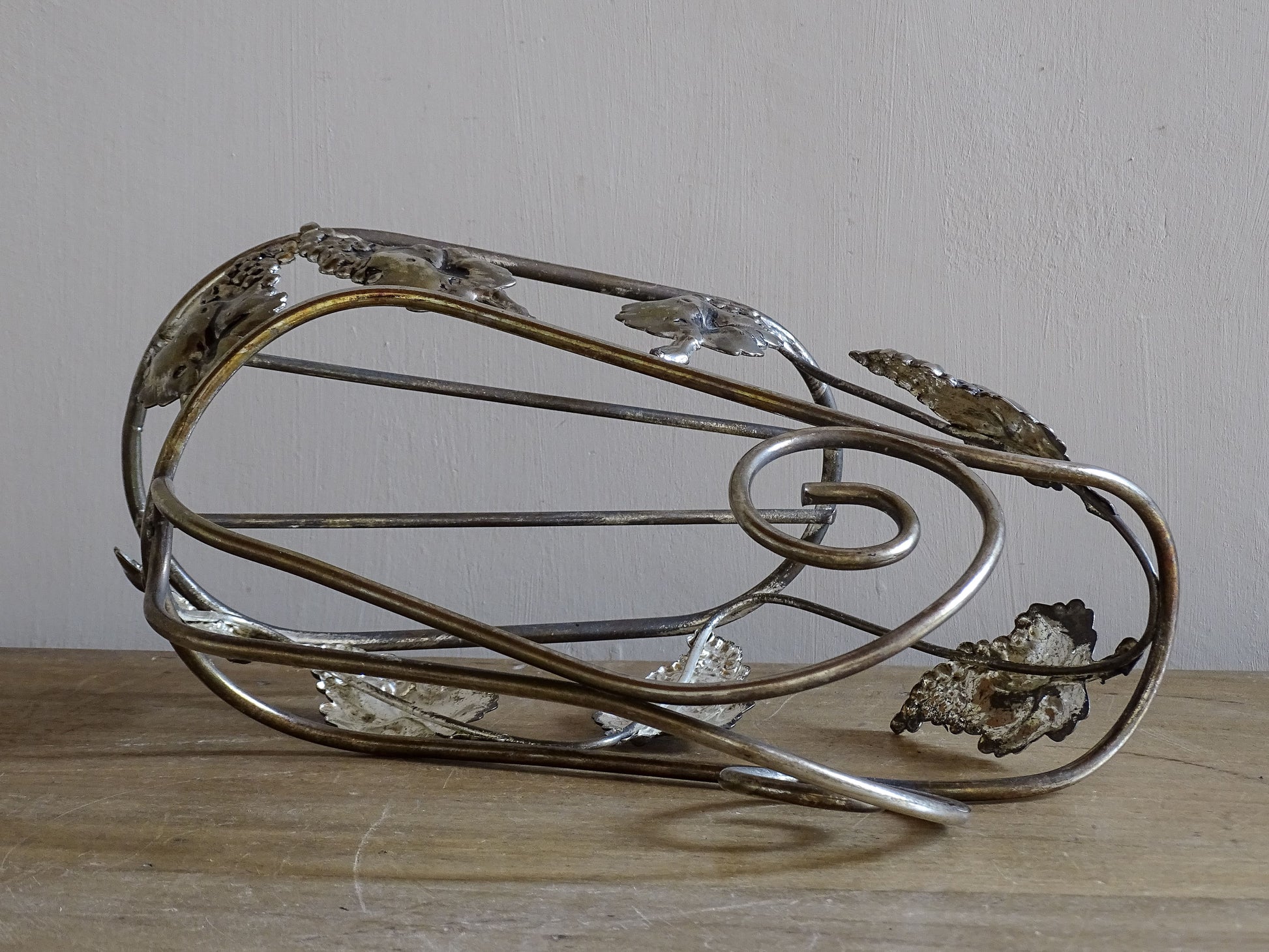 Vintage French wine bottle cradle in silvered metal with sculptural curved design
