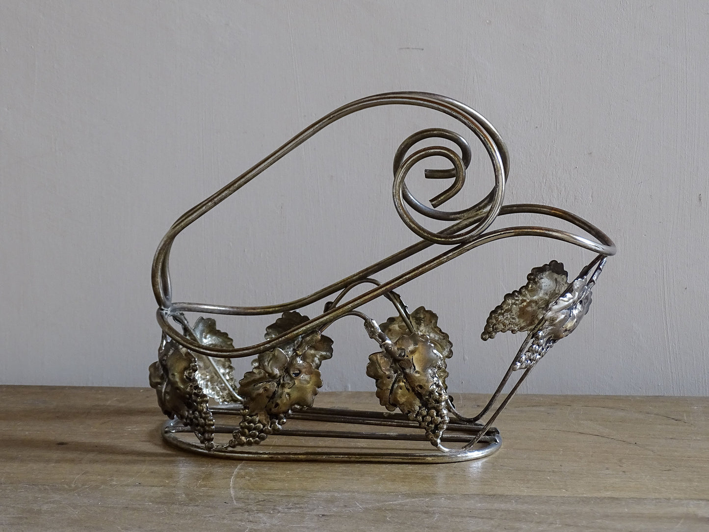 French vintage tabletop wine bottle holder with silver-toned grapevine decoration