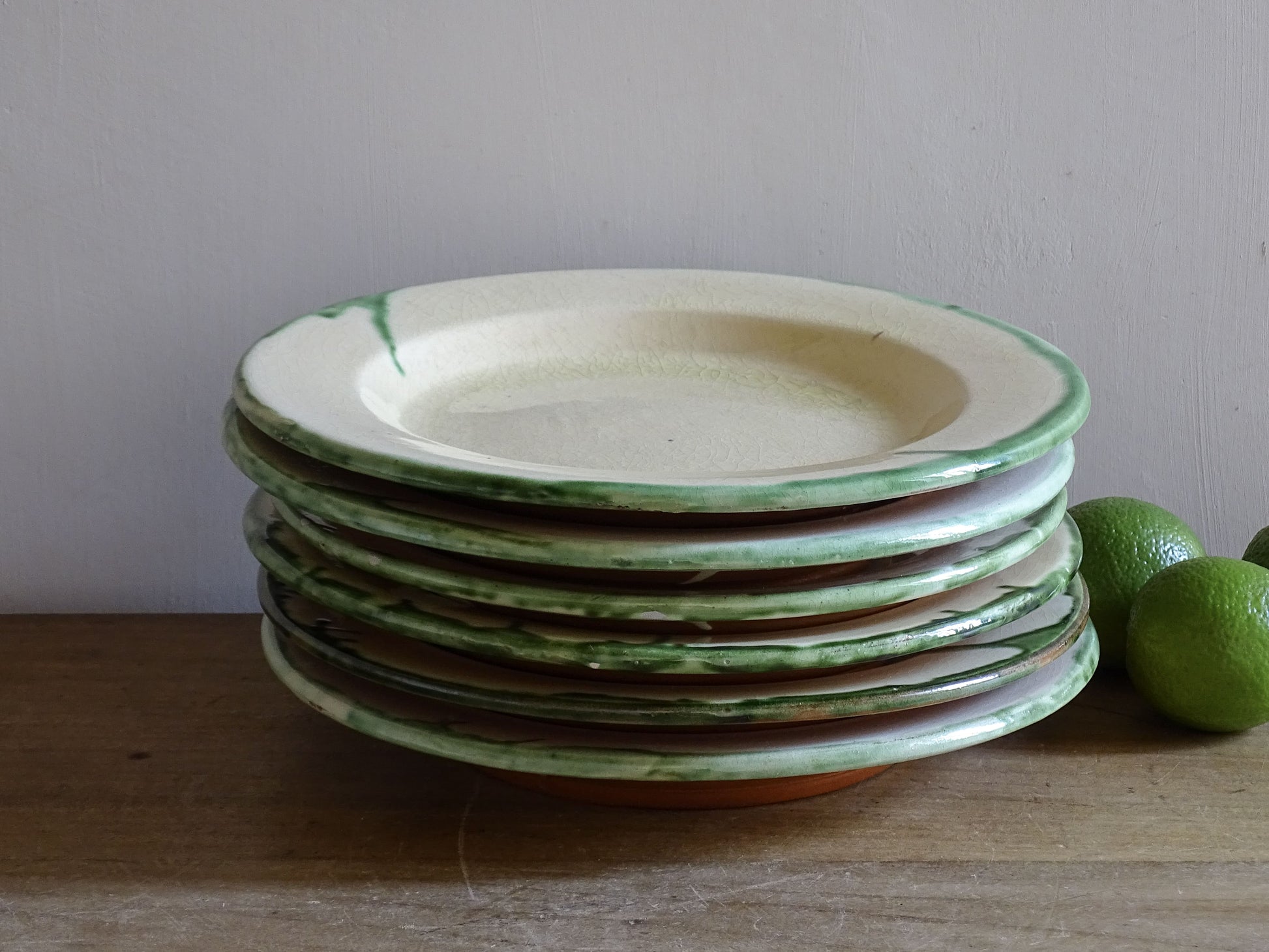 Vintage provincial French pottery plates with cream glaze and green edging