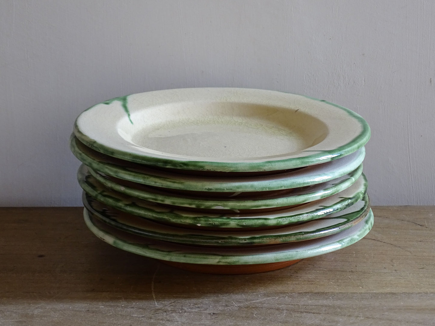 Decorative stack of French rustic earthenware plates from the mid 20th century