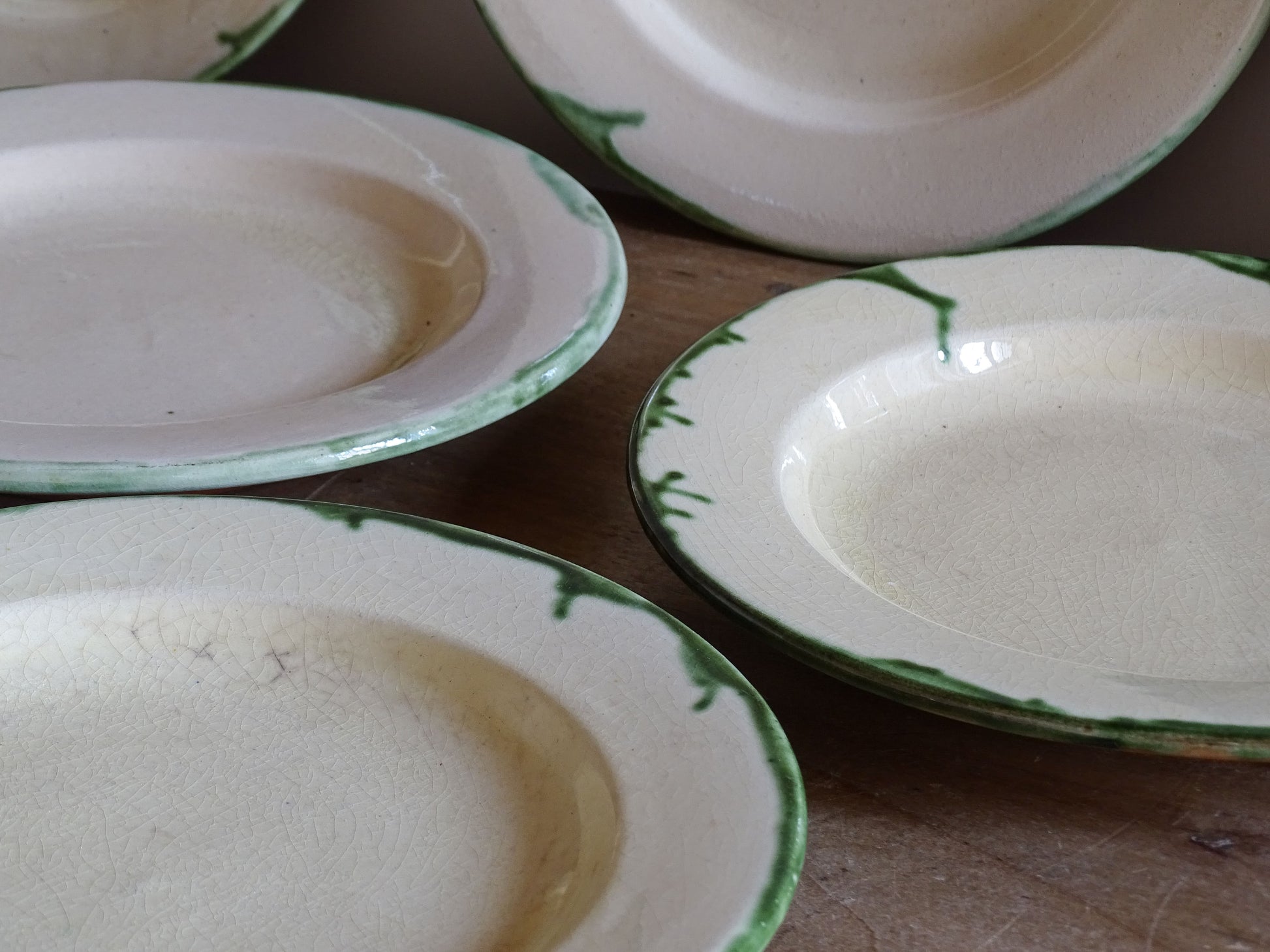 Close up of vintage French pottery plate with crackled glaze detail
