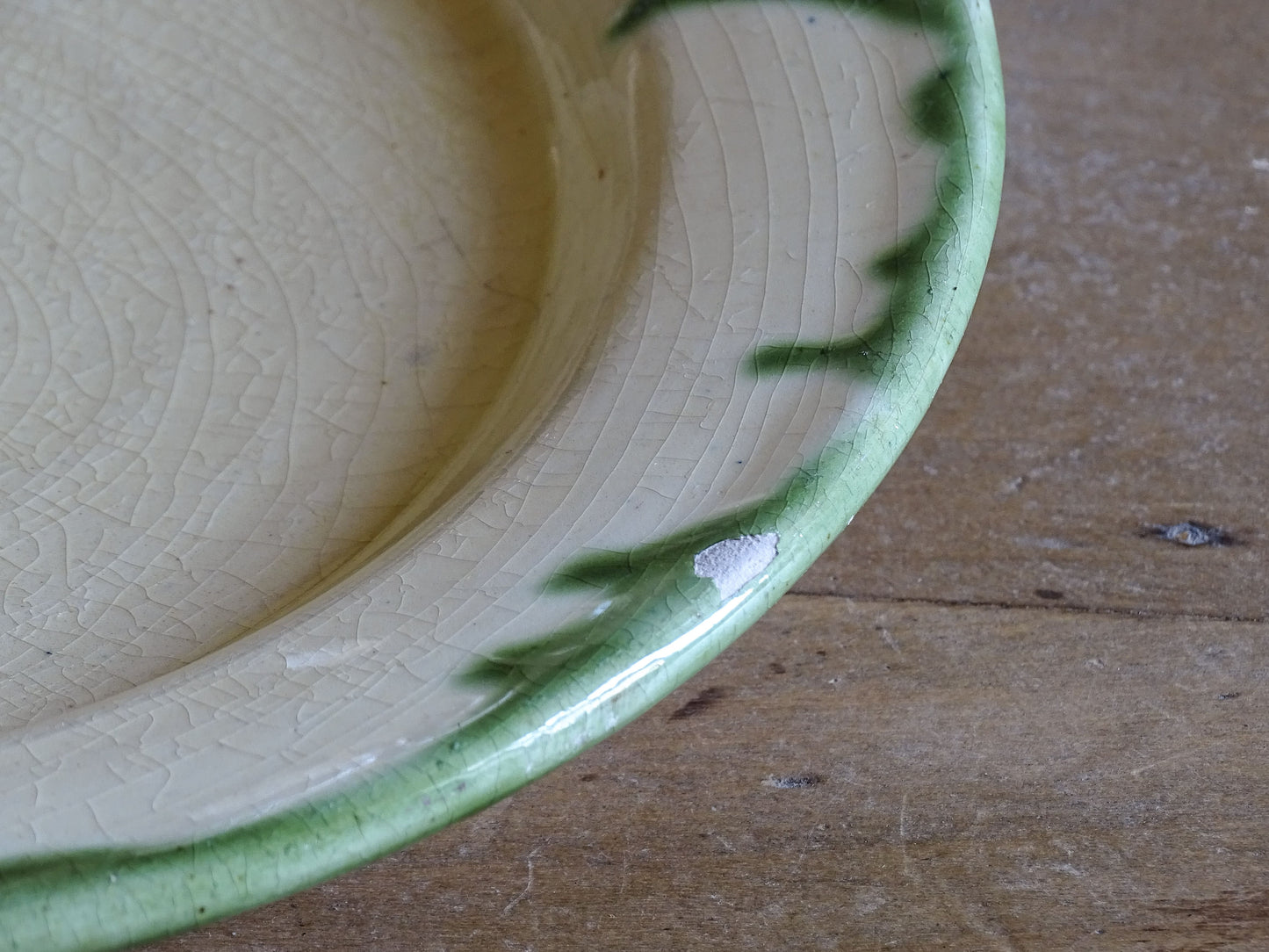 Set of French vintage ceramic dinner plates with hand applied green decoration