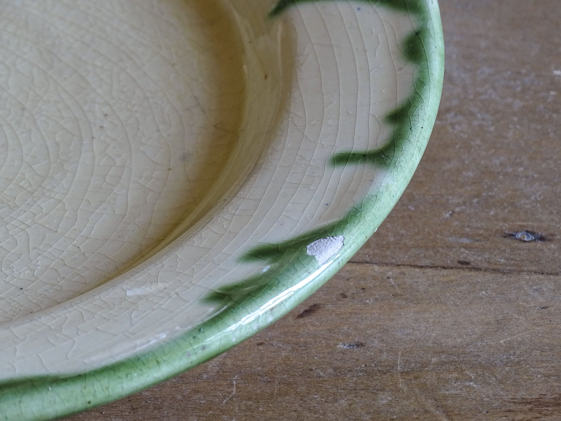 Set of French vintage ceramic dinner plates with hand applied green decoration