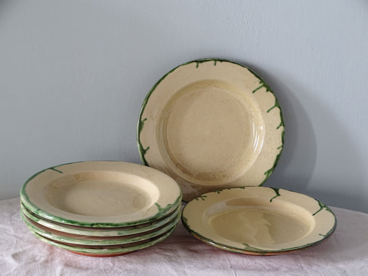 Set of six vintage French earthenware plates with green drip glaze rims