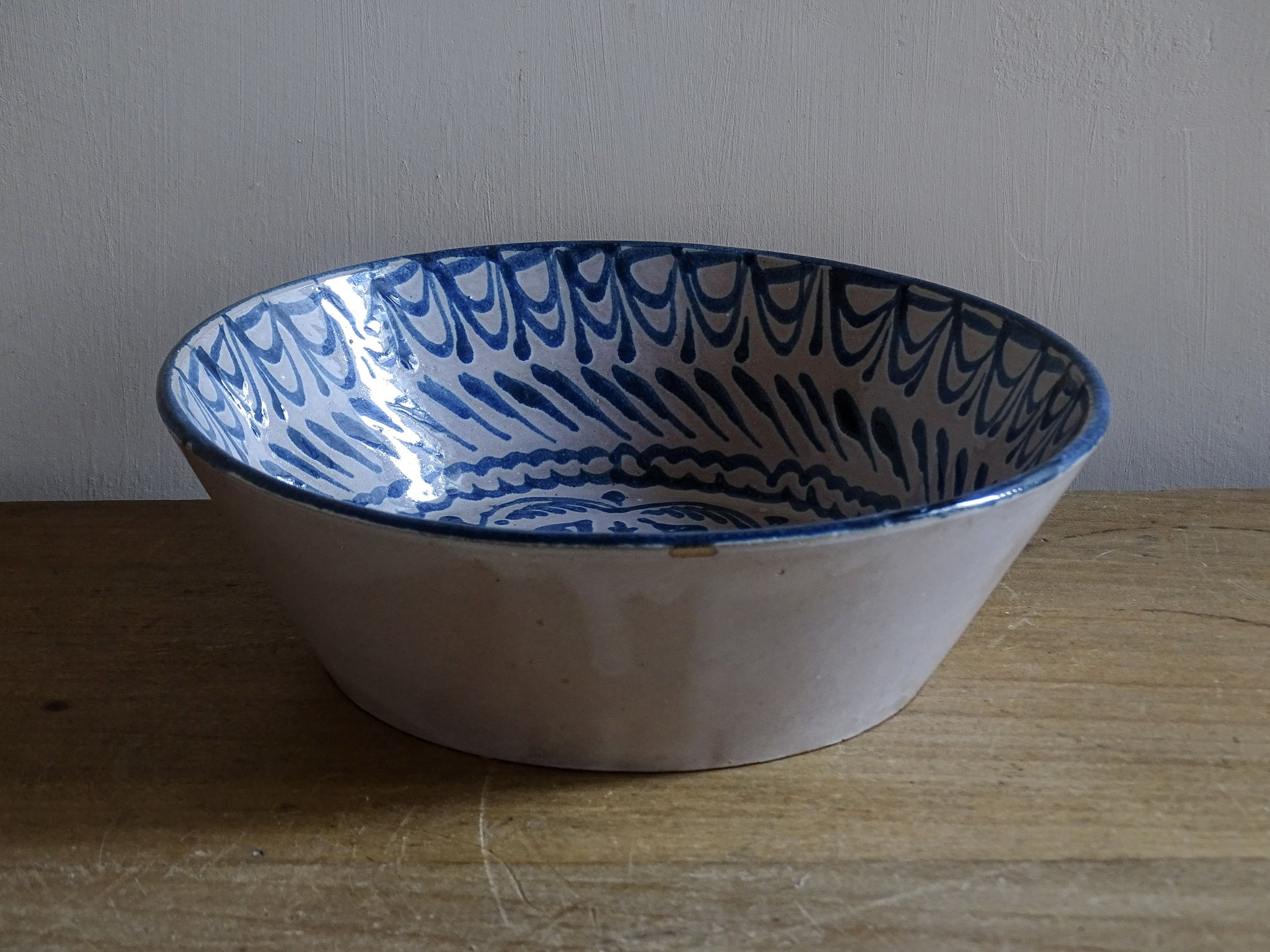 Hand-painted Spanish ceramic lebrillo bowl displayed on a wooden table