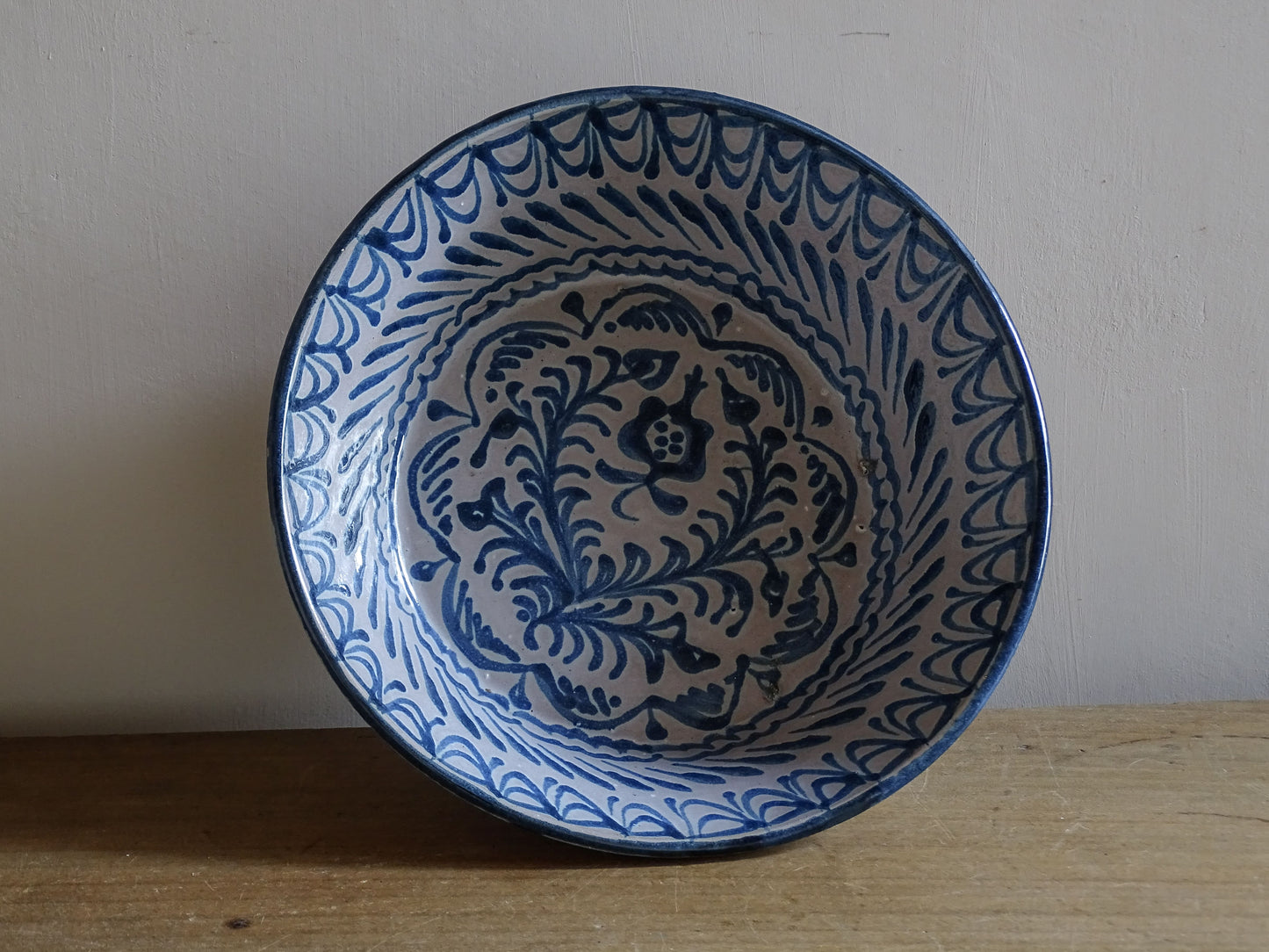 Vintage Mediterranean pottery bowl with hand-painted cobalt blue glaze