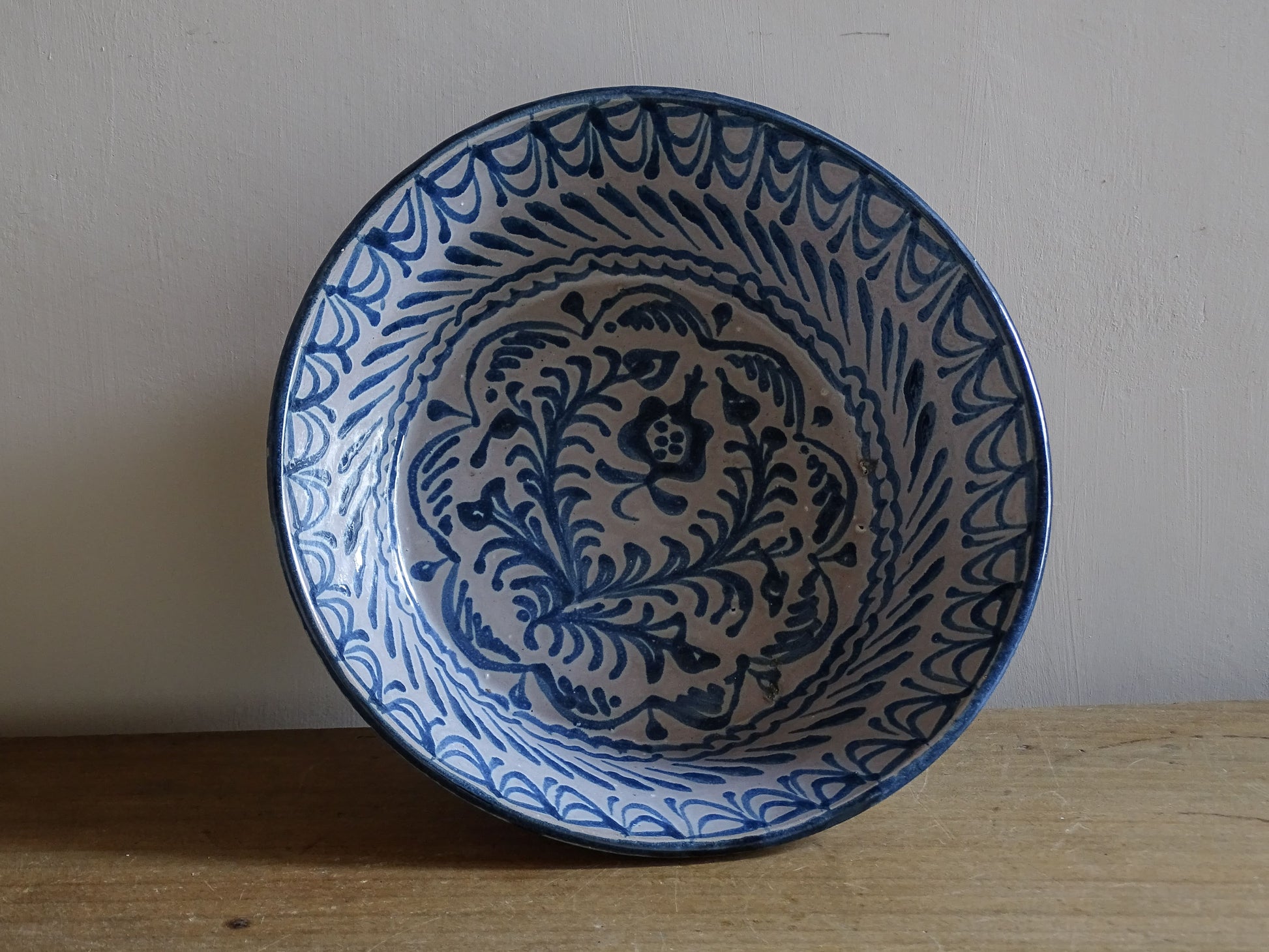 Vintage Mediterranean pottery bowl with hand-painted cobalt blue glaze
