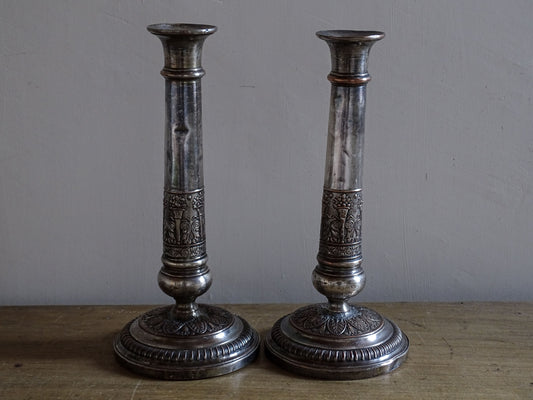 French antique silver plate candlesticks with classical urn motifs and aged patina