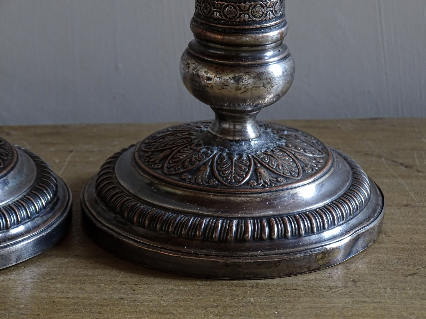 French antique silver plate candlesticks with classical urn motifs and aged patina